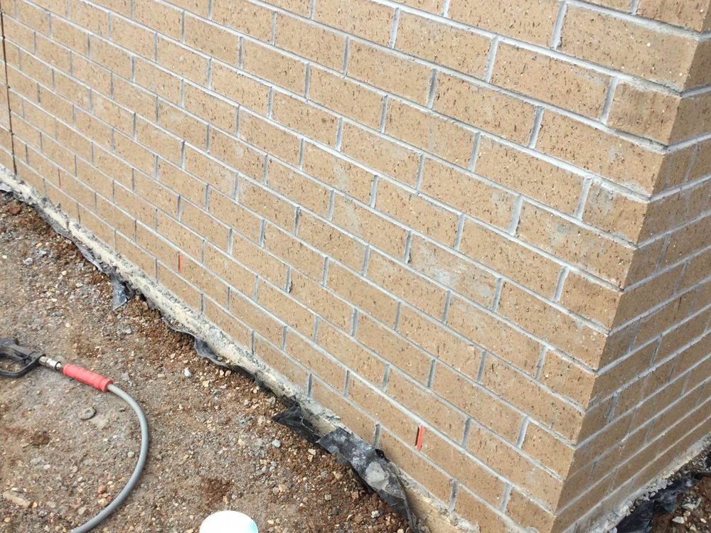 Brickwork still to be washed down to remove mortar staining, found during a fixing inspection in Tarneit