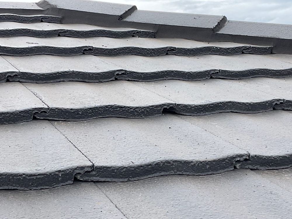 Broken tile underlaps that let rain through in a storm, found during a lock-up inspection in Tarneit