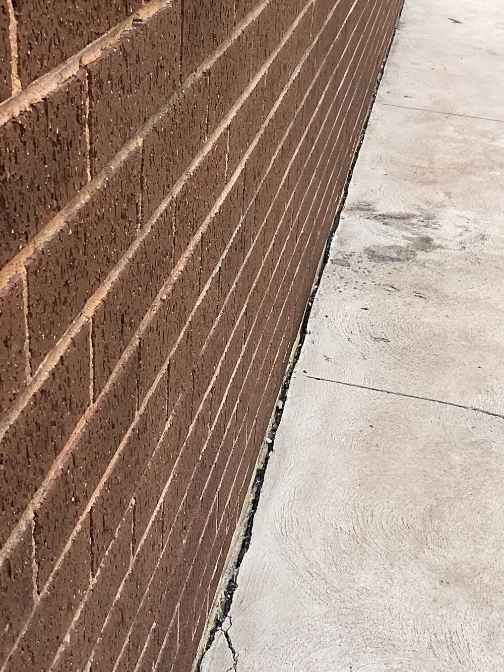 Expansion joint filler burnt away and never replaced, leaving a large gap, found during a defect investigation inspection in Tarneit
