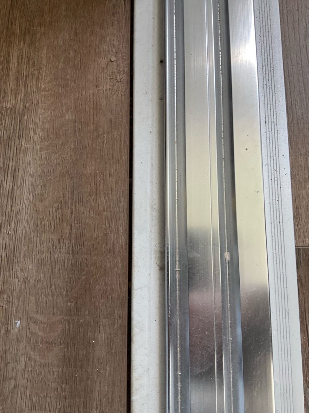 Floor to skirting joint left uncaulked, found during a pre-handover inspection in Tarneit