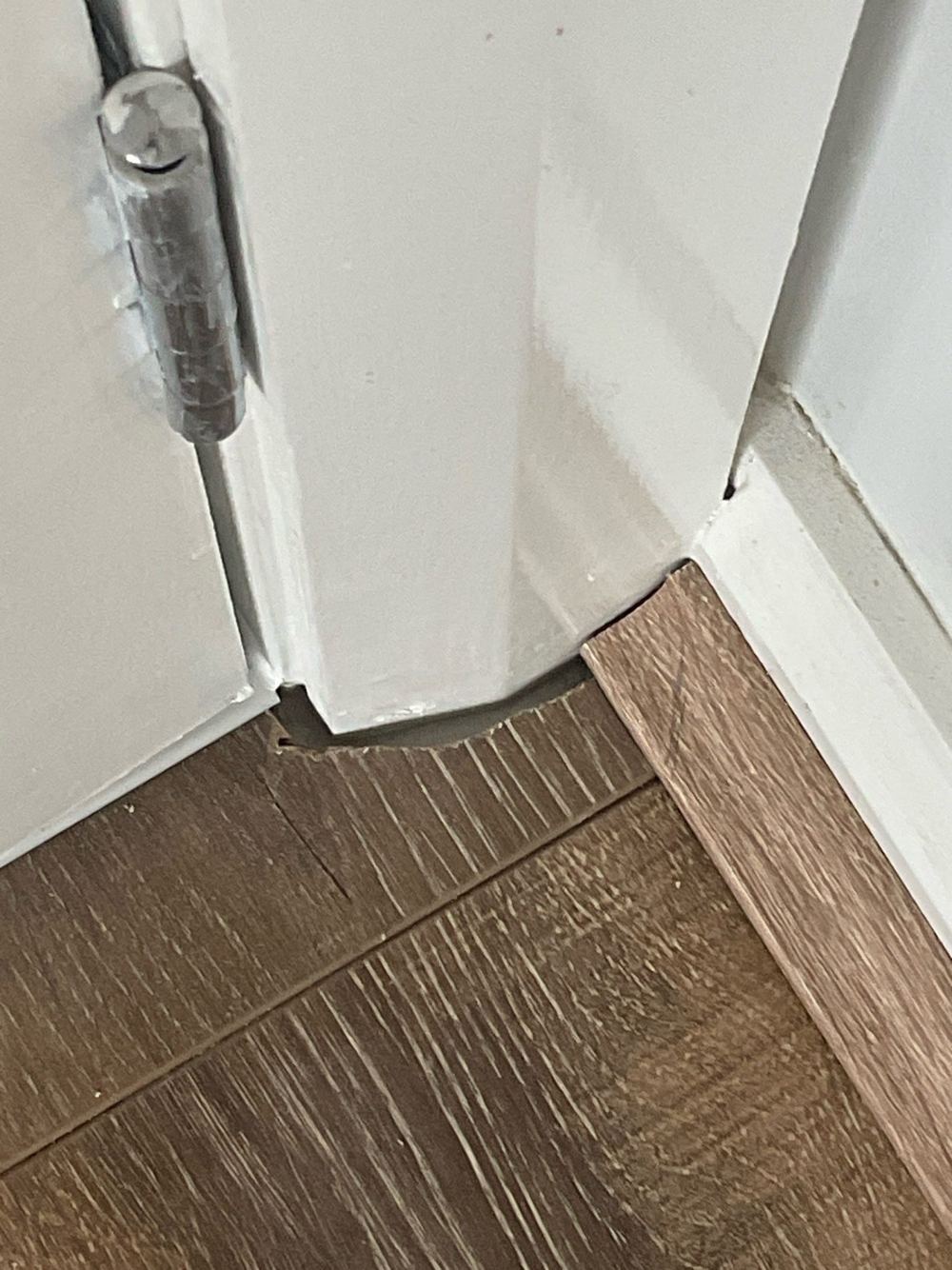 Laminate cut around the architrave instead of running under it, leaving a gap, found during a defect investigation inspection in Tarneit