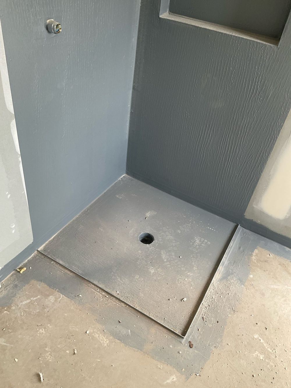 Membrane left unprotected and open to damage before tiling, found during a waterproofing inspection in Tarneit