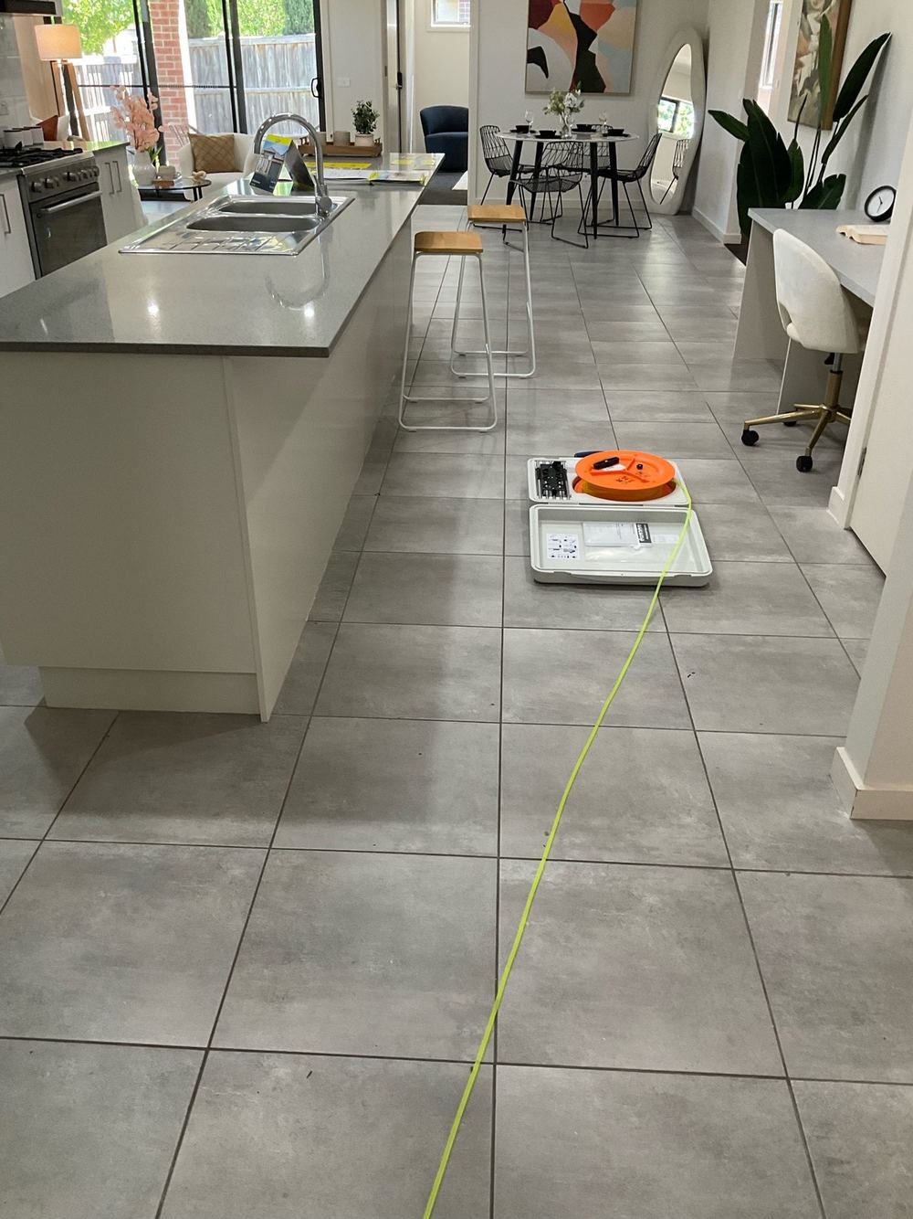 Slab out of level by 25mm, beyond the allowed tolerance, found during a building and pest inspection in Point Cook