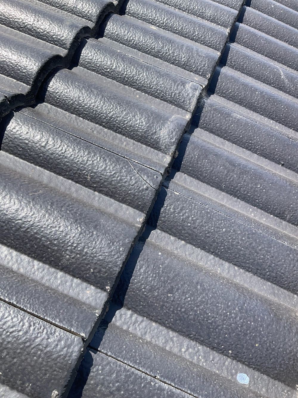 Cracked tiles that will eventually let water through, found during a pre-purchase inspection in Truganina